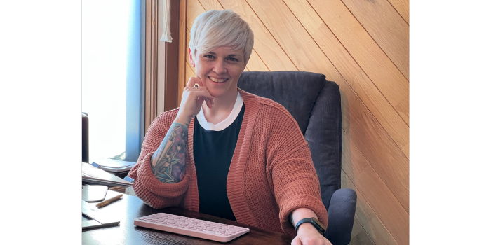 Dr. Rachael O'Connell sitting at her desk.